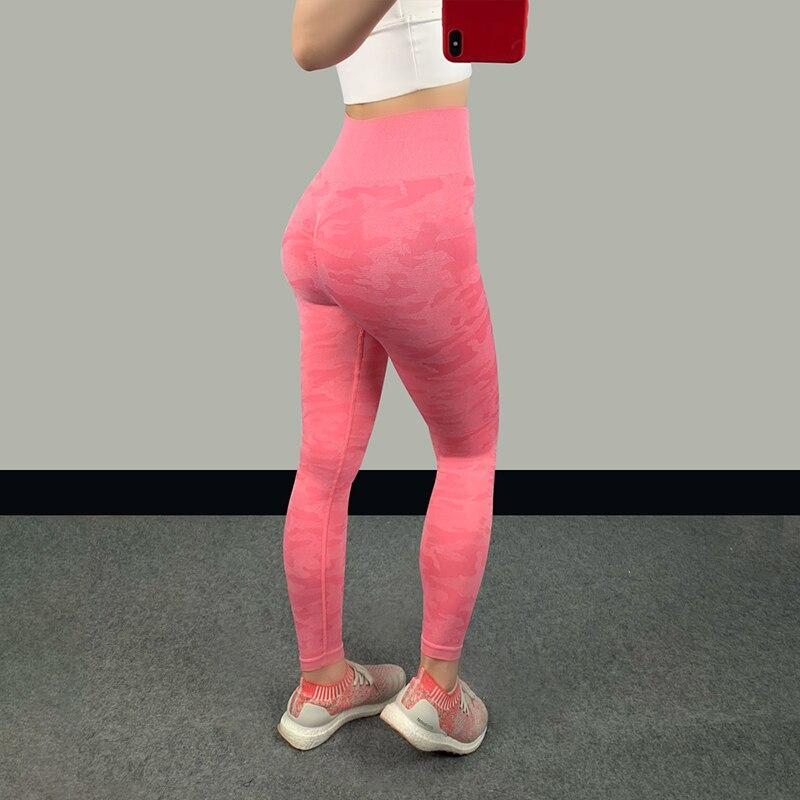 High waist fitness leggings in pink, featuring a seamless design that hugs curves for a sculpted look.