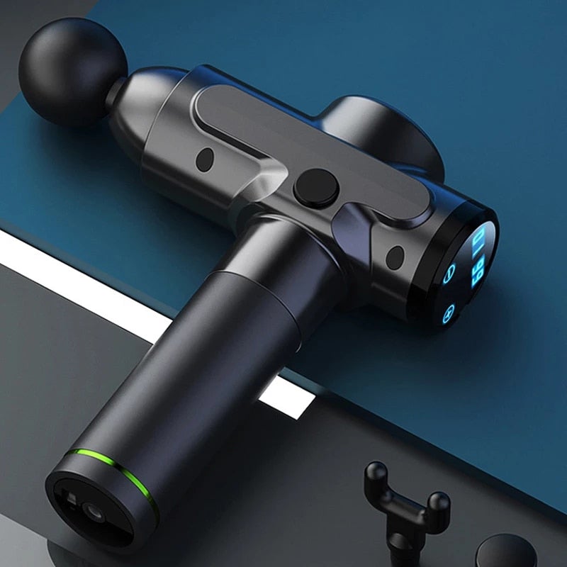Power Pulse Massage Gun resting on a table, designed for deep muscle relief and recovery.