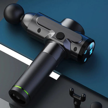 Power Pulse Massage Gun resting on a table, designed for deep muscle relief and recovery.
