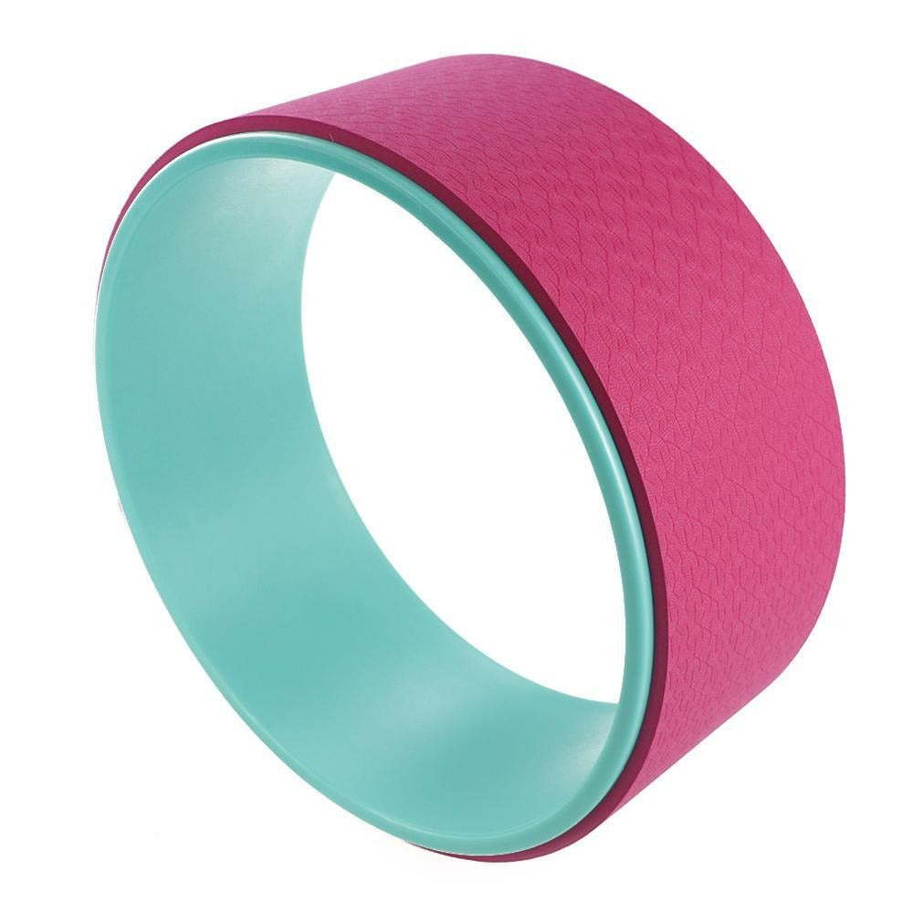 Yoga Pilates Circle Ring in pink and teal, designed to enhance balance, flexibility, and posture during workouts.