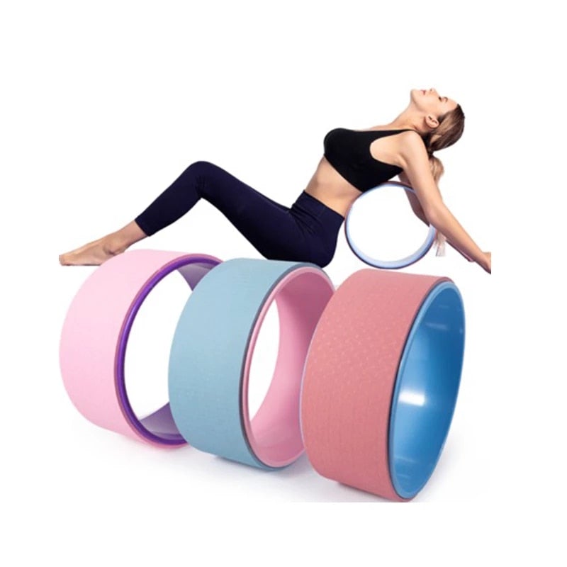 Woman using Yoga Pilates Circle Ring with multiple rings for deep stretches, flexibility, and improved balance.