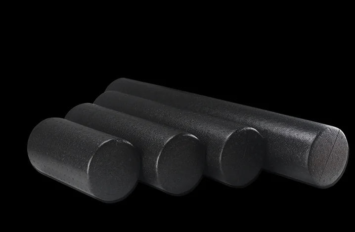 Yoga Foam Roller - Fitness Equipment set of four black foam rollers for muscle recovery and flexibility training.