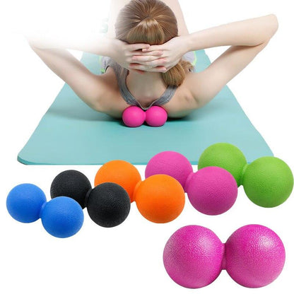 peanut massage ball for muscle relief, colorful massage balls used for deep tissue relaxation on yoga mat.